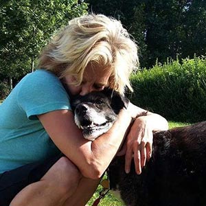 Colleen Rauschenberg hugging her dog Ben
